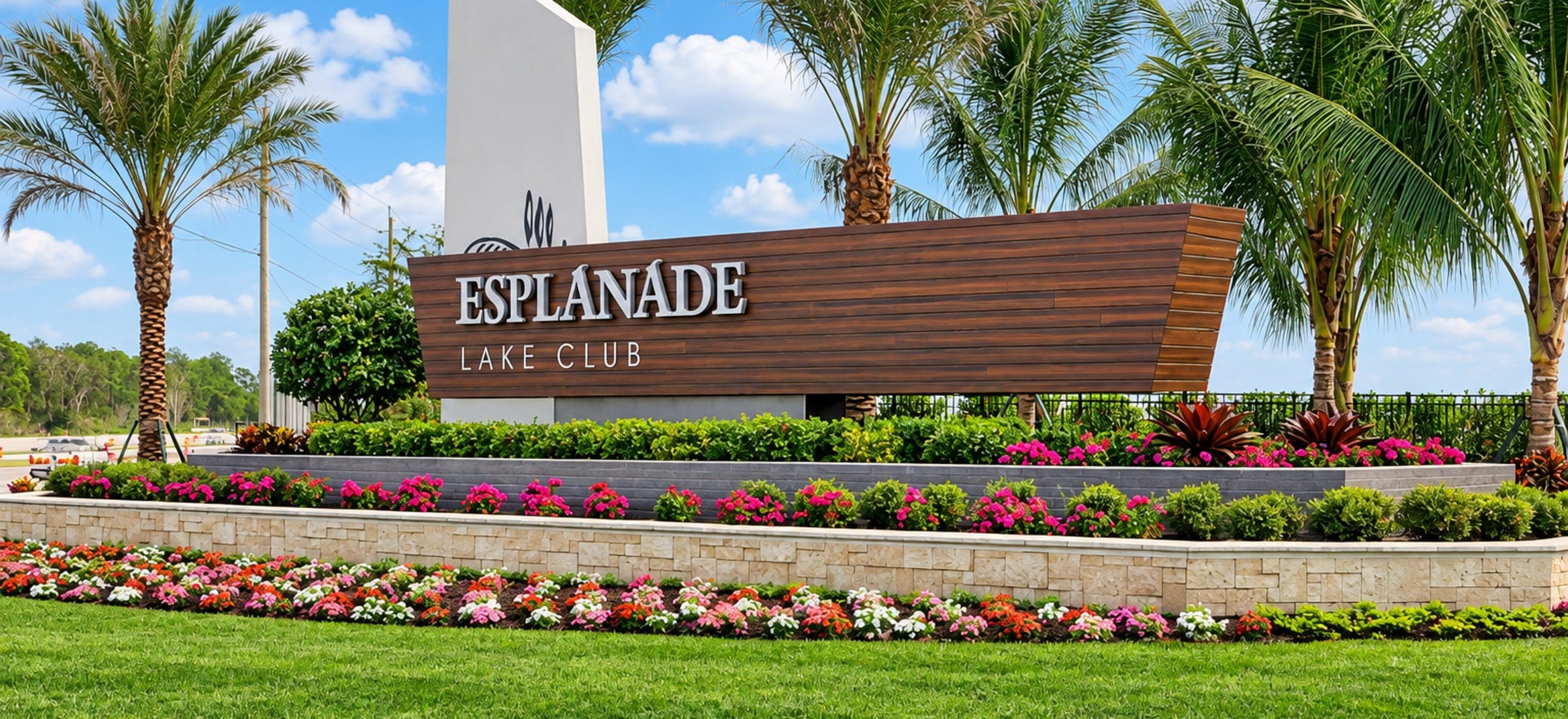 The entrance at Esplanade Lake Club, a gated community in Fort Myers, Florida, built around a lake.