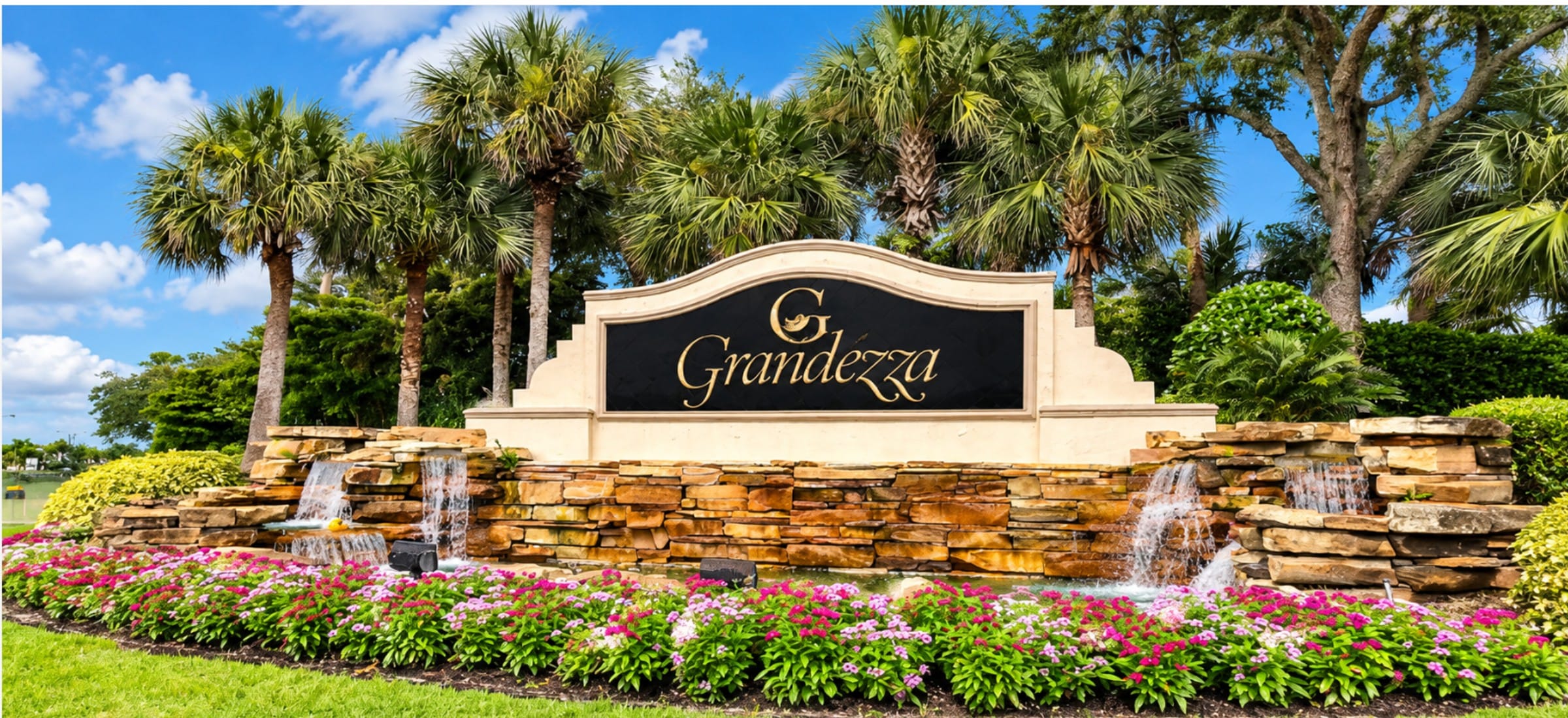 The entrance at Grandezza, a gated golf community in Estero, Florida, built around a lake.